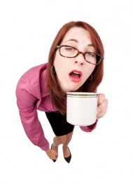 Half Asleep Woman With First Cup of Coffee